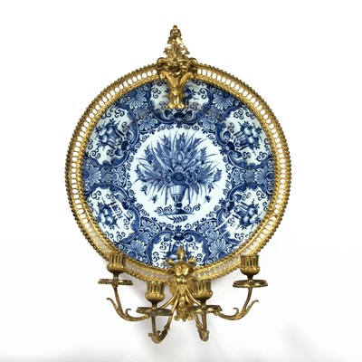 Lot 288 - An 18th century Delft blue and white charger,...