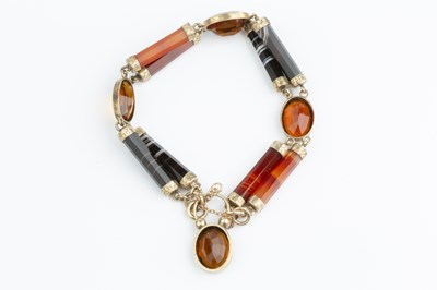 Lot 18 - A Victorian hardstone panel bracelet, designed...