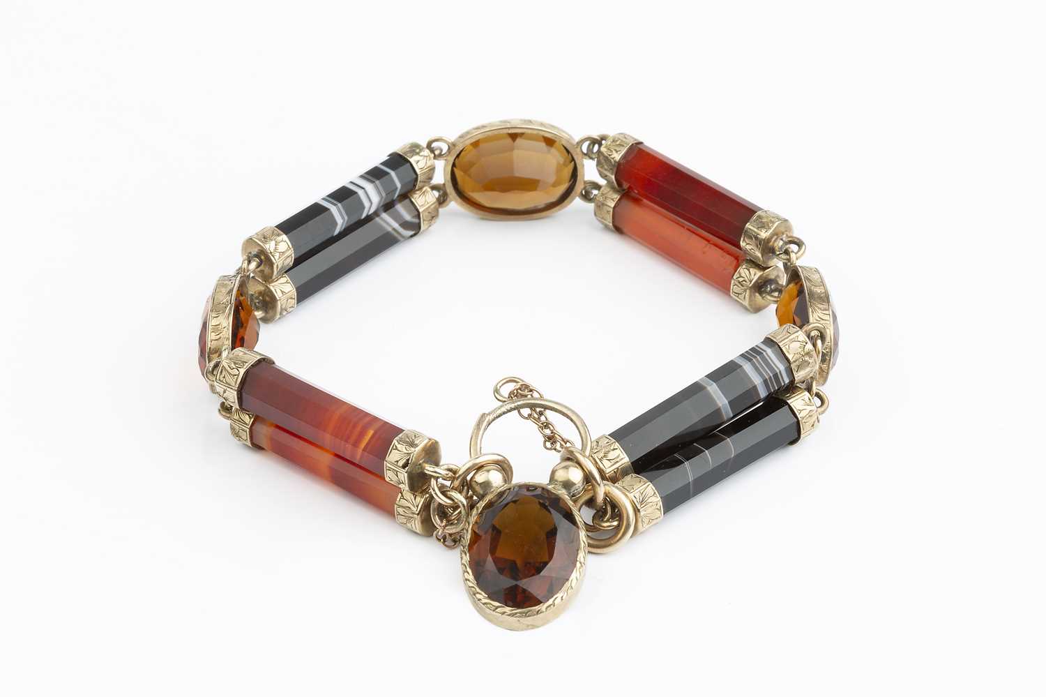 Lot 18 - A Victorian hardstone panel bracelet, designed...