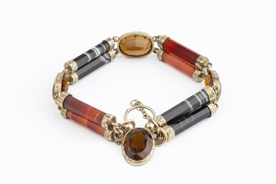 Lot 18 - A Victorian hardstone panel bracelet, designed...