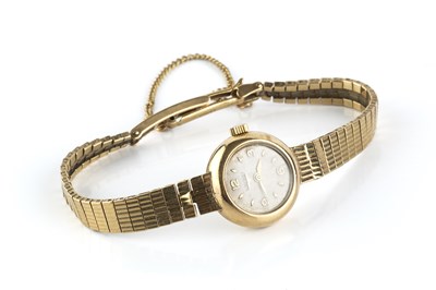 Lot 228 - A lady's 9ct gold bracelet watch by Longines,...