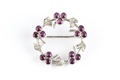 Lot 89 - A ruby and diamond wreath brooch, designed as...