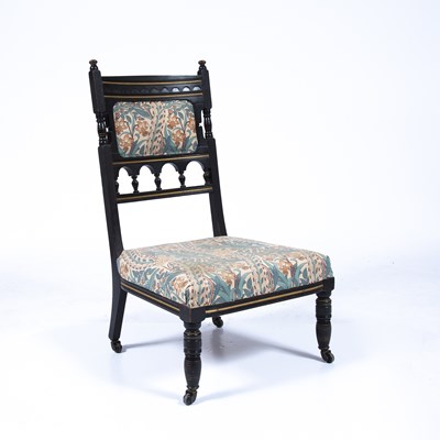 Lot 59 - Aesthetic movement ebonised low chair, with...