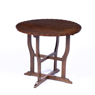 Lot 11 - Cotswold School oak circular topped table,...