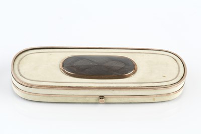 Lot 332 - A Georgian ivory patch box, of elongated oval...