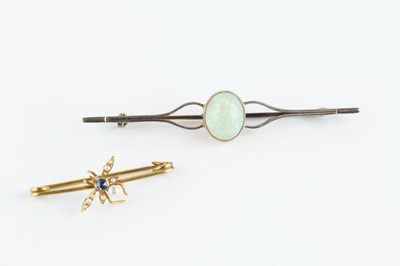 Lot 86 - An opal single stone bar brooch, the oval...