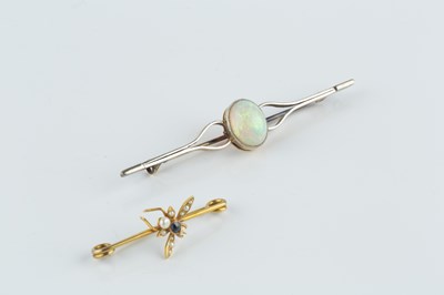 Lot 86 - An opal single stone bar brooch, the oval...