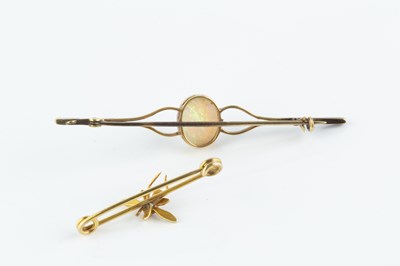 Lot 86 - An opal single stone bar brooch, the oval...