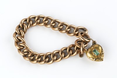 Lot 13 - A curb-link bracelet with gem set clasp, the...