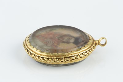 Lot 51 - A reliquary pendant, containing portrait...