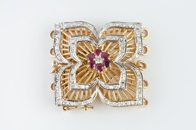 Lot 71 - A ruby and diamond set clasp, modelled as a...