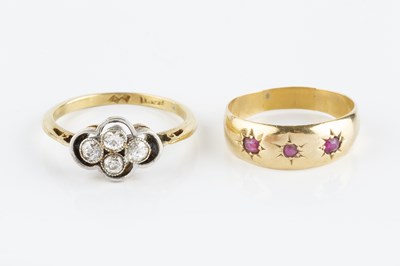 Lot 63 - A diamond four stone ring, designed as an...