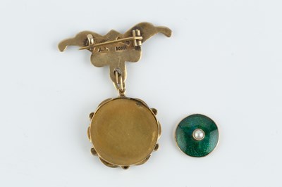 Lot 83 - An enamel and half pearl pendant, centred with...