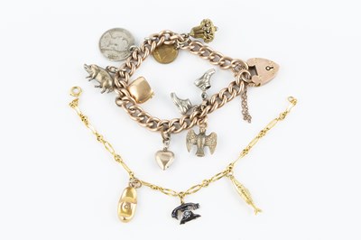 Lot 84 - Two charm bracelets, the first a hollow...