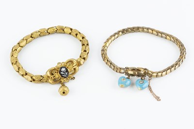 Lot 16 - Two Victorian gilt metal bracelets, the first...