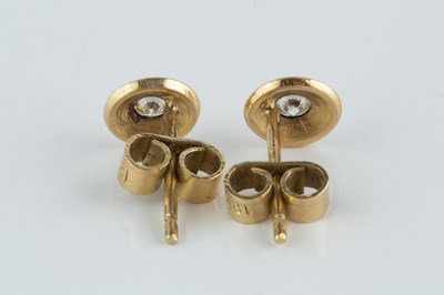 Lot 79 - A pair of diamond ear studs, each round...