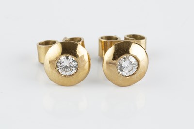 Lot 79 - A pair of diamond ear studs, each round...