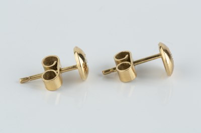 Lot 79 - A pair of diamond ear studs, each round...