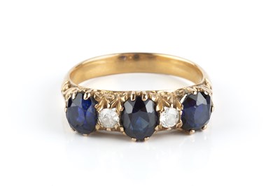 Lot 163 - A sapphire and diamond half hoop ring, the...