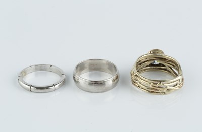 Lot 110 - Two 9ct white gold wedding bands, the first...