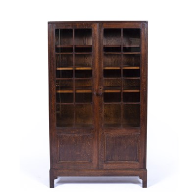 Lot 115 - Heals oak, glazed bookcase, circa 1920, has a...