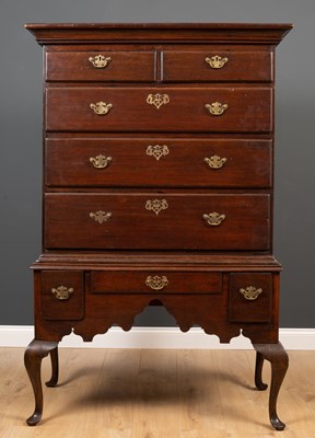 Lot 292 - A George III oak chest on stand all supported...