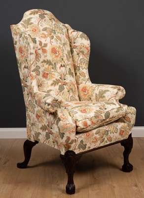 Lot 293 - A George II style wingback armchair with...