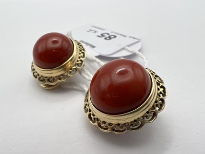 Lot 85 - A pair of coral ear clips, each coral...