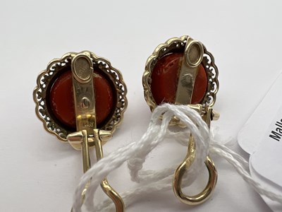 Lot 85 - A pair of coral ear clips, each coral...