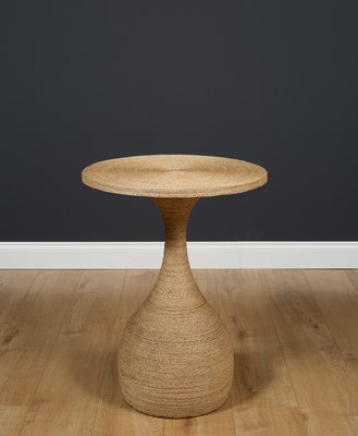 Lot 121 - A circular string covered occasional table...