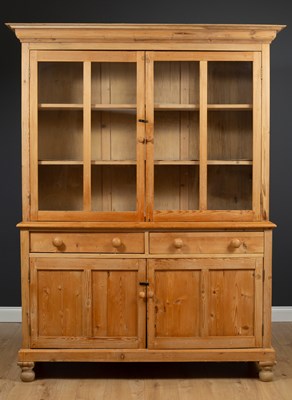 Lot 234 - A pine dresser, the glazed upper section...