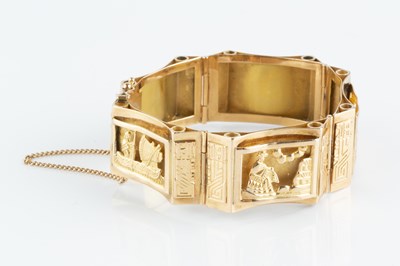 Lot 118 - A yellow precious metal panel bracelet, the...