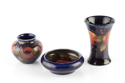 Lot 688 - Moorcroft Three pomegranate pattern pieces a...