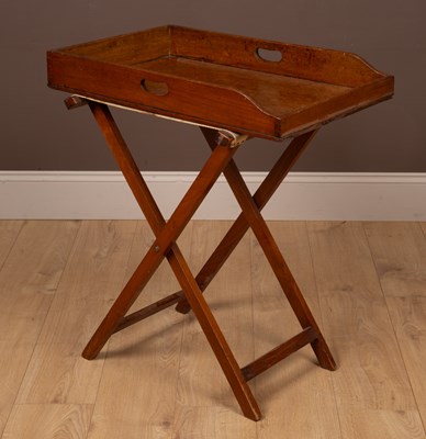 Lot 361 - A mahogany butlers tray and stand