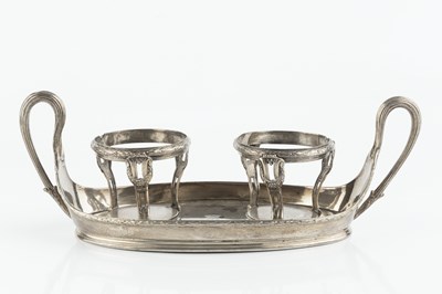 Lot 374 - A George III silver twin handled bottle stand,...