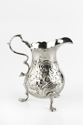 Lot 610 - A George II silver cream jug, the baluster...