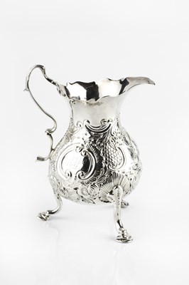 Lot 611 - A George II silver baluster cream jug,...