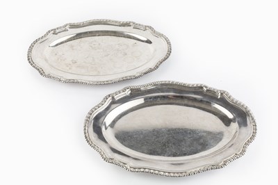 Lot 383 - A pair of George II silver oval platters, with...