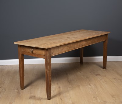 Lot 130 - A rectangular pine kitchen table with single...