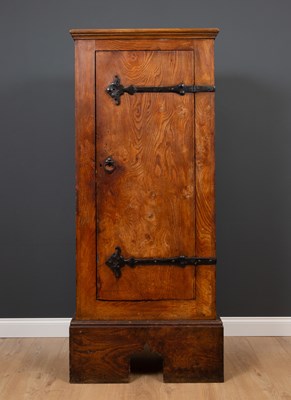 Lot 131 - An elm arts and crafts style cupboard with...