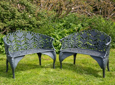 Lot 699 - A pair of green painted cast iron garden...