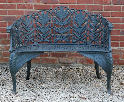 Lot 699 - A pair of green painted cast iron garden...