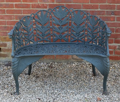 Lot 699 - A pair of green painted cast iron garden...