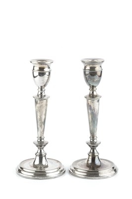 Lot 385 - A pair of silver candlesticks, with knopped...