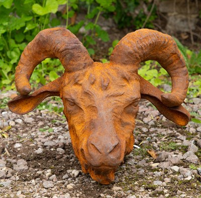 Lot 813 - A horned cast iron goats head for wall...