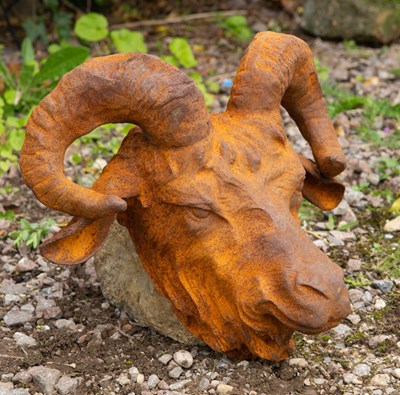 Lot 813 - A horned cast iron goats head for wall...