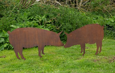 Lot 816 - A pair of large steel profile pigs with stakes...