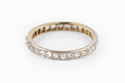 Lot 120 - A diamond full hoop ring, set throughout with...