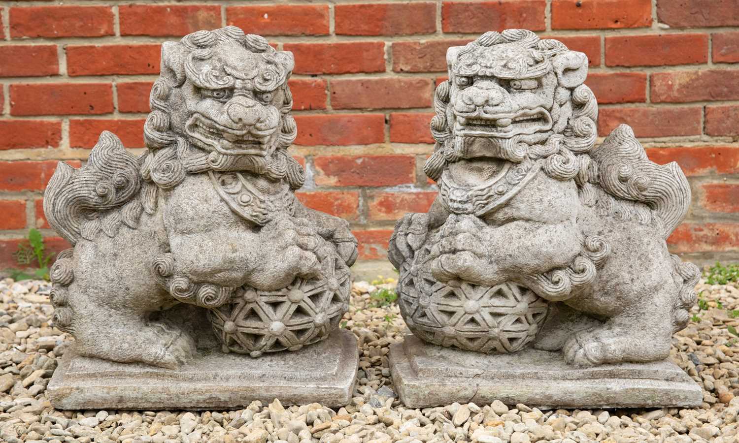 Lot 821 - A pair of cast reconstituted stone sculptures...