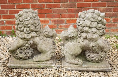 Lot 821 - A pair of cast reconstituted stone sculptures...